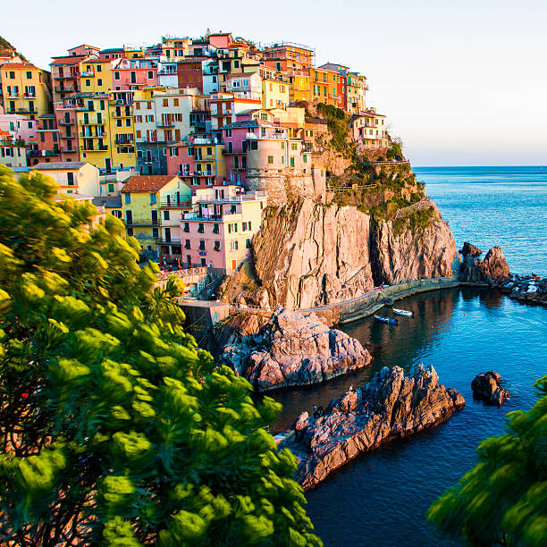 Sunset in Manarola, Cinque Terre, Italy. Amazing town in the italian mediterranean sea coast.