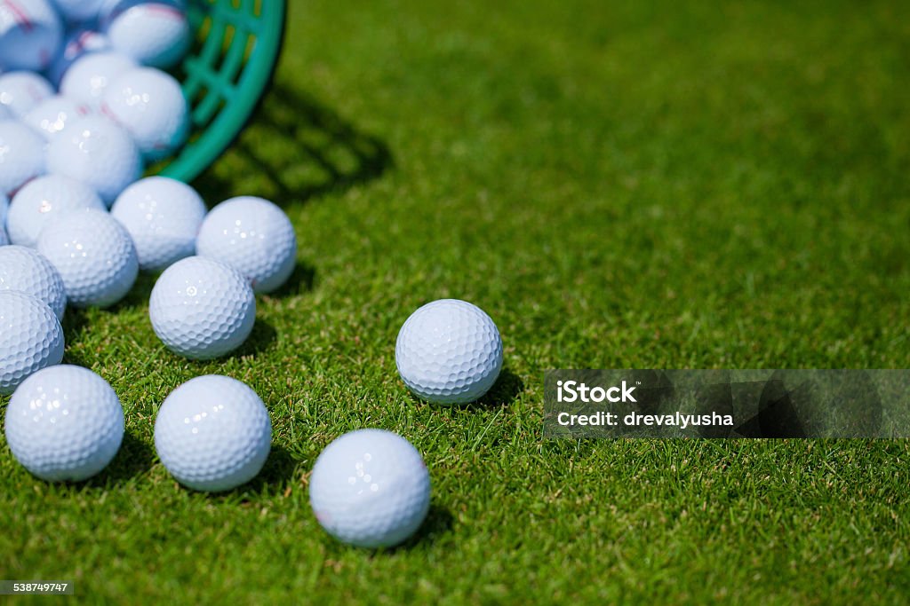 Golf balls .basket A bucket of golf balls at the driving range Golf Stock Photo