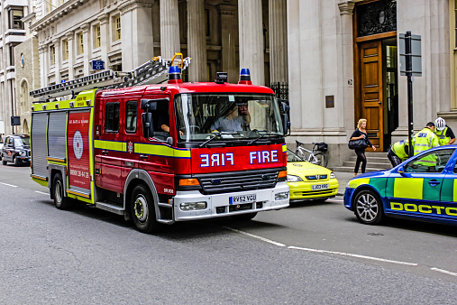 London, England, UK - August 16, 2007: A  London Fire Brigade dual-purpose ladder (DPL) standard fire engine on route to a 999 emergency call in central London