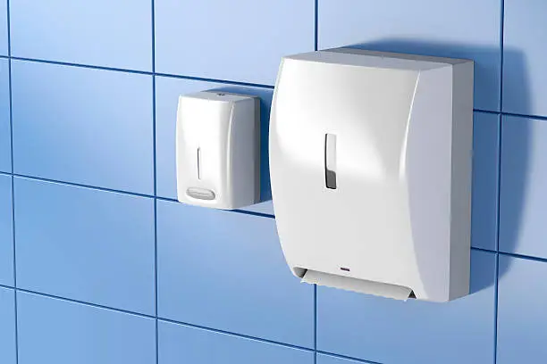 Paper towel dispenser and soap dispenser in public toilet