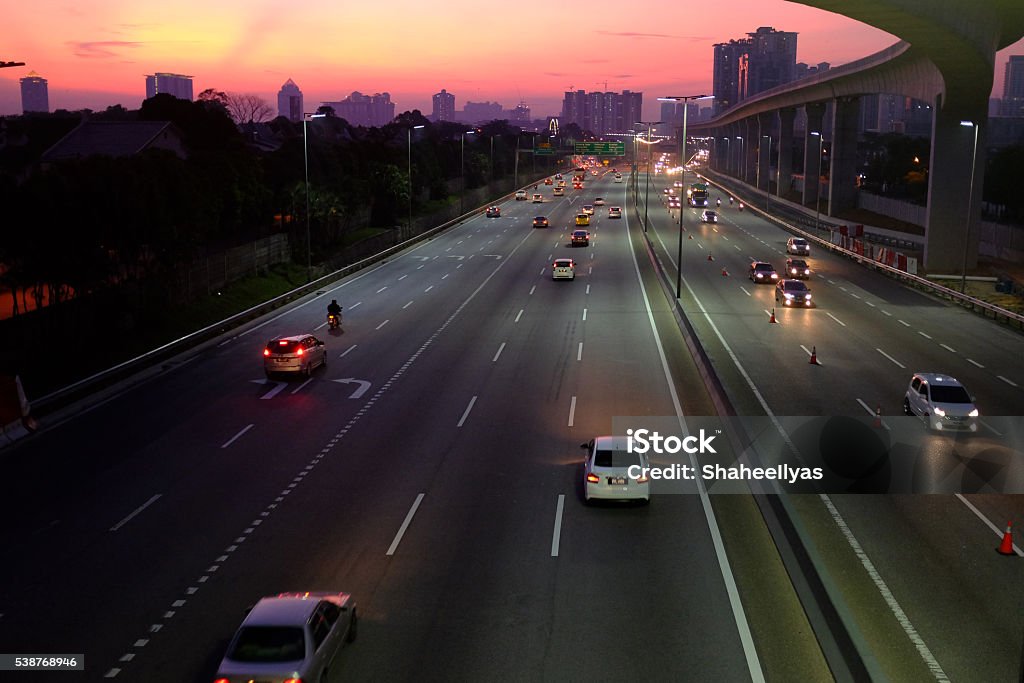sunrise over highway sunrise over Kesas highway, Malaysia Dawn Stock Photo