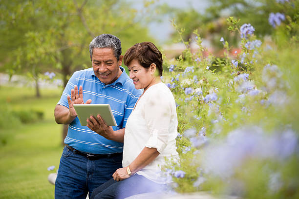 istock Happy senior couple with digital tablet 538771283