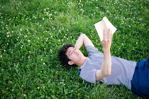 I photographed the man who read on a lawn