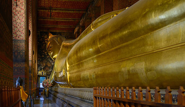 istock Reclining Buddha gold statue face. Wat Pho, Bangkok, Thailand 538771569