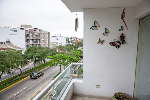 Lima, Peru - January 7, 2015: Lima taxi passing on residential street