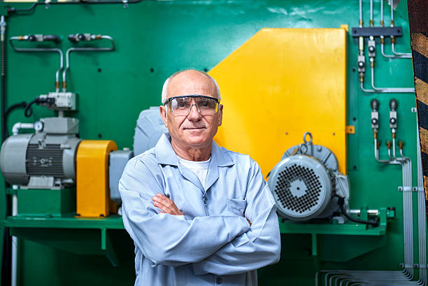 Portrait Of Senior Worker In Factory Portrait of confident senior worker. one senior man only stock pictures, royalty-free photos & images