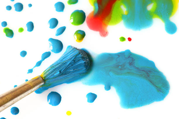 istock Abstract colorful drops of paint and brush 538773772