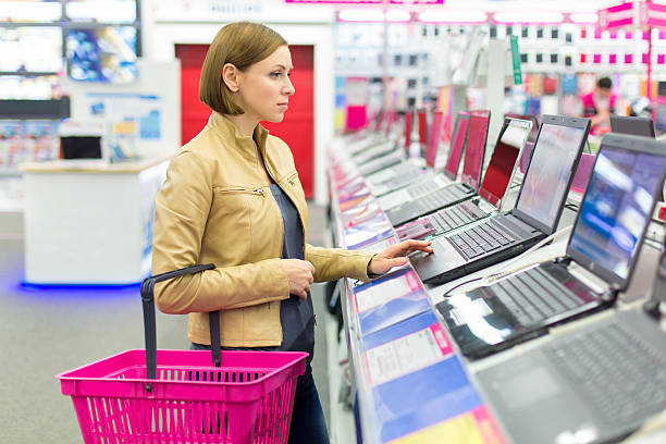 istock woman chooses the laptop 538774333