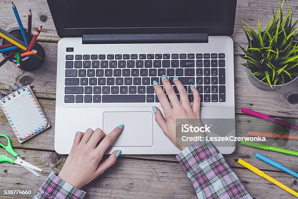 Overhead Shot Of Woman Working On Laptop Stock Photo - Download Image Now - Adult, Computer, Desk