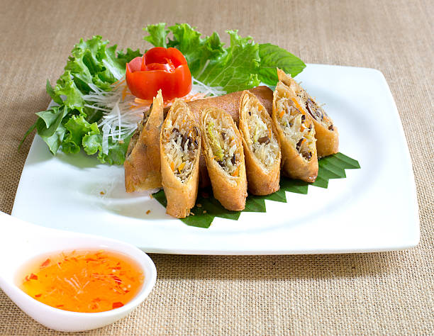 istock Veg. Spring Rolls with sweet sauce, on white dish 538775110