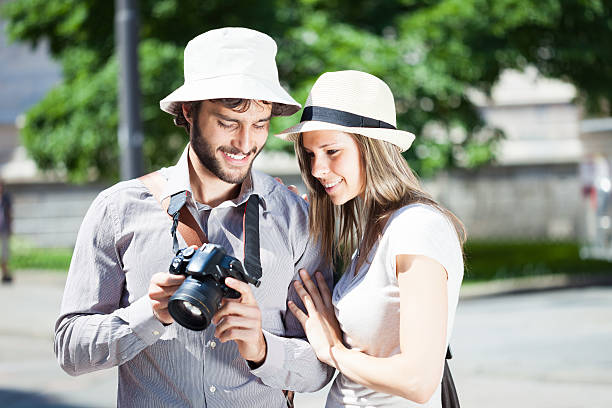 istock Man showing pictures to his girlfriend 538775324