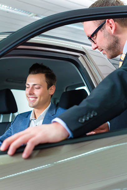 istock Client buying new car in dealership 538775916