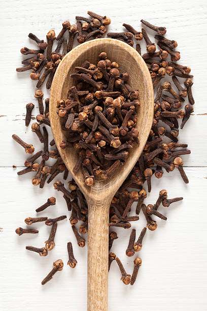 istock Close up of cloves in spoon on white table 538776876