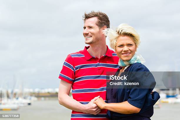Couple Hugging At Marina Pier Stock Photo - Download Image Now - Adult, Baltic Countries, Baltic Sea