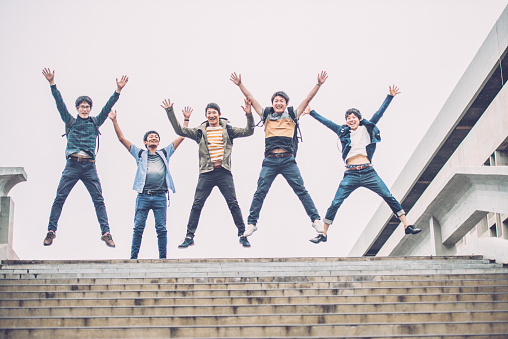 Five male japanese students jumping, having fun on the staircase, Kyoto, Japan, Asia. One is standing among them. Copy space. Nikon D800, full frame, XXXL. iStockalypse Kyoto 2016.