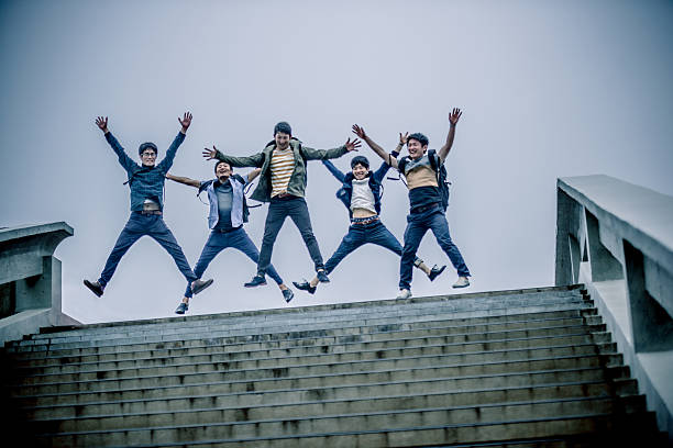 istock Five Japanese Students Jumping, Campus, Kyoto, Japan, Asia 538777872
