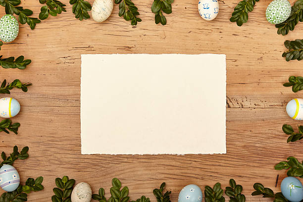 istock Easter eggs and twigs, blank card on wood 538778275