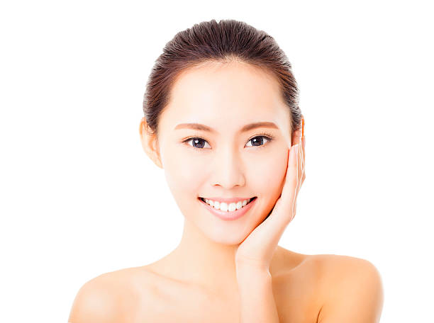 istock closeup smiling young  woman face isolated on white 538778913