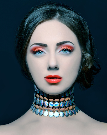 elegant retro woman with makeup and jewelry.