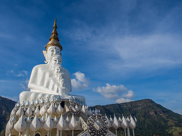 istock Five of white Buddha statue on blue sky background. 538780050