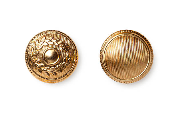 Golden buttons Golden buttons. button sewing item stock pictures, royalty-free photos & images