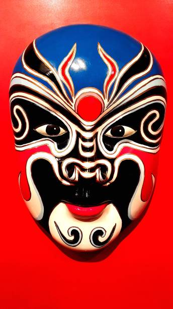 istock Chinese Traditional Opera Mask on red background 538781276
