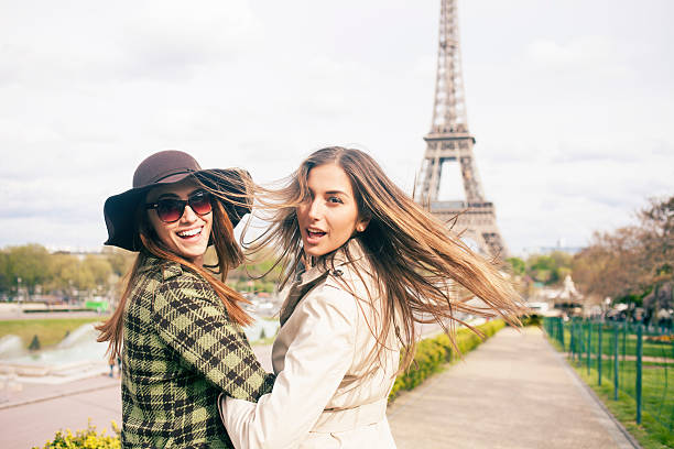 istock Two cheerful young women having fun and holding hands 538782882