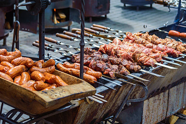 istock grilled sausages and meat on skewers 538783844