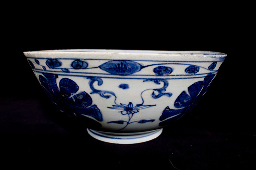 Blue and White Antique Chinese Bowl on Black Background from a ship wreck