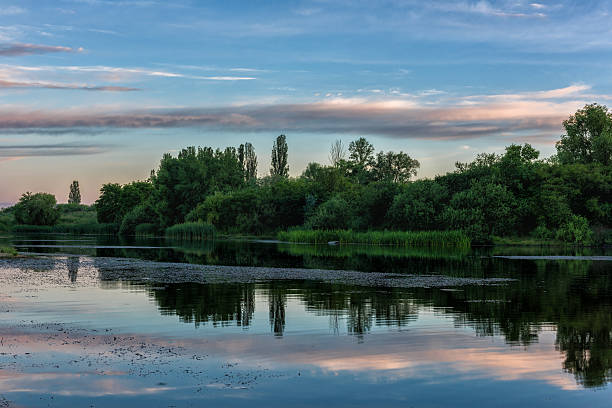 istock Colorful twilight landscape over the lake with reflection and greenery 538784288
