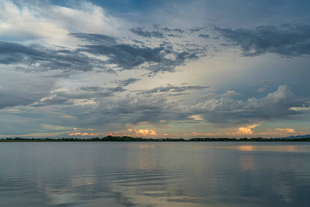 istock stormy evening sky over  lake 538788260