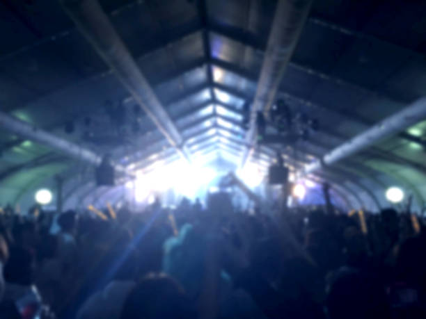 istock blurred lighting in concert with cheering audience 538788474