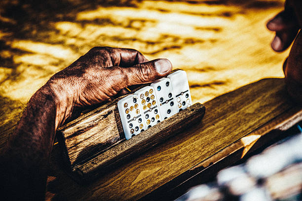 Hands of domino player in Santiago de Cuba, Cuba.
