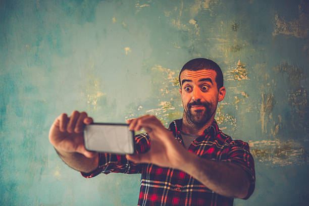 istock Young Man Having Fun while Taking Selfie, Paris, France 538793460