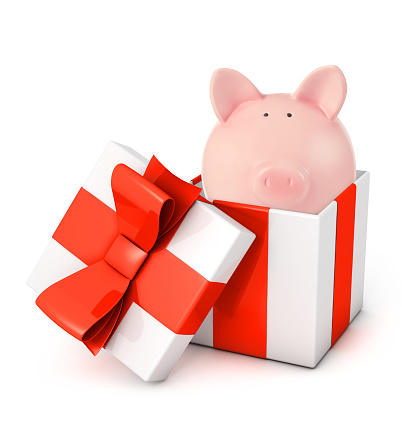 Gift box with piggy bank isolated on white