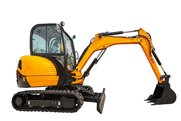 Small or mini excavator isolated with clipping path Small or mini excavator with clipping path isolated on white background mechanical digger stock pictures, royalty-free photos & images