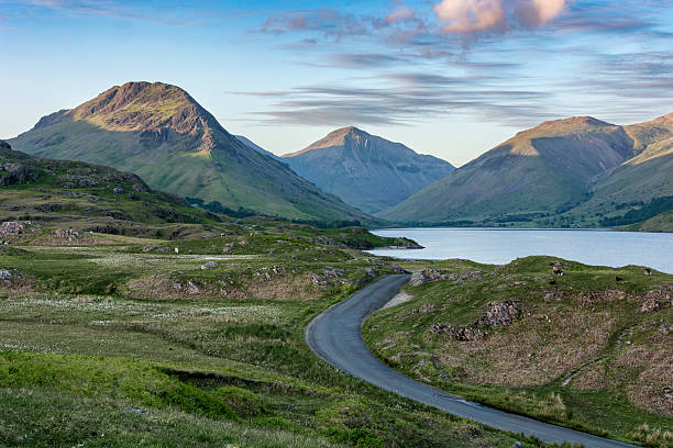 istock Winding Country Road With Beautiful Light On Mountains. 538795776