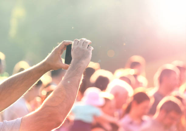 istock Shooting photos with a mobile phone in a crowd 538797674