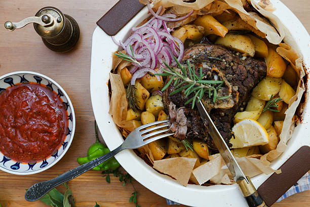 istock Kleftiko - slowly cooked lamb with vegetables and feta cheese 538797798