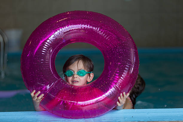 istock Young ethnic boy swimming in a pool 538799988