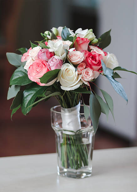 istock bridal bouquet standing in a glass on a wooden table 538802306