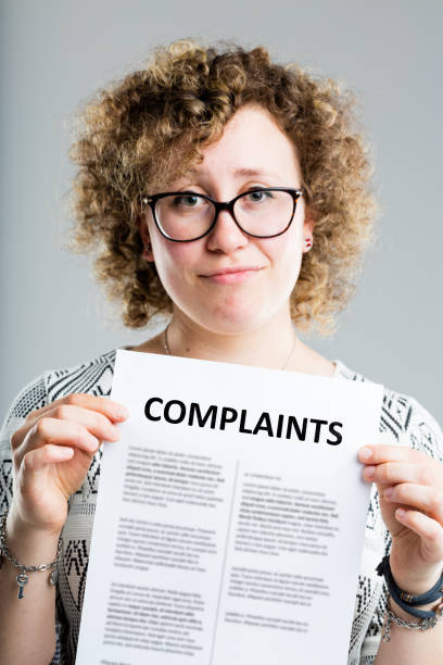 istock unhappy woman showing a complaints form 538802758
