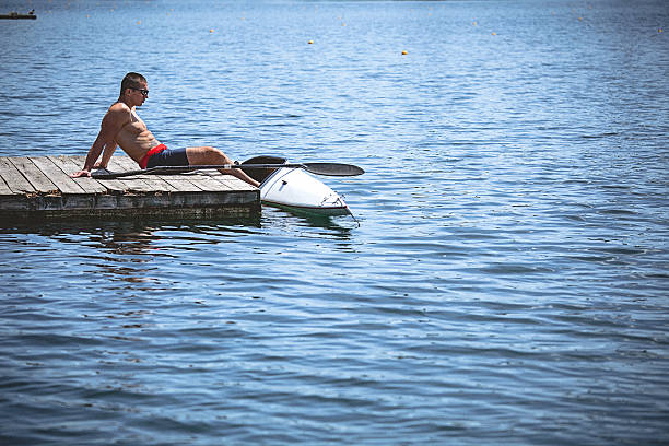 istock Young muscular man relaxing after kayak sprint training 538804356