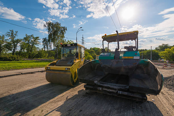 istock Paver machinery and road roller at sunny day 538804868