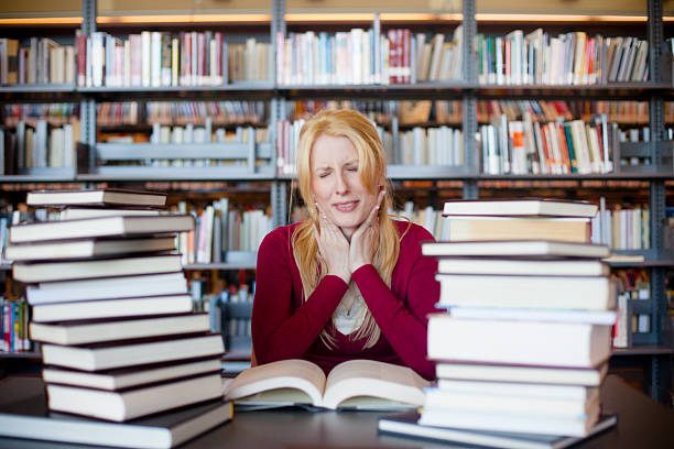 istock Stressed Out Woman Studying in the Library 538808500