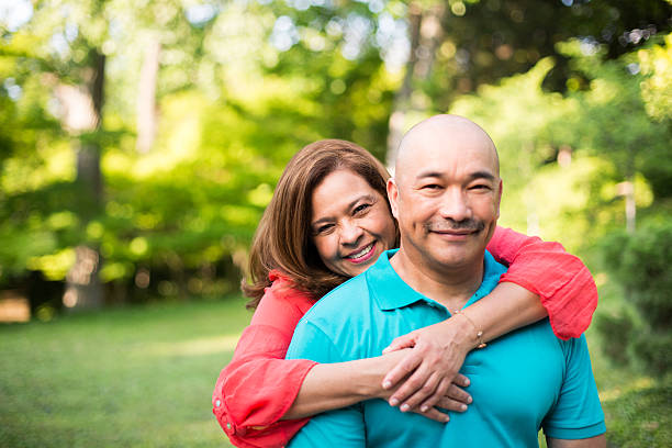 istock Happy mature couple in park 538810849