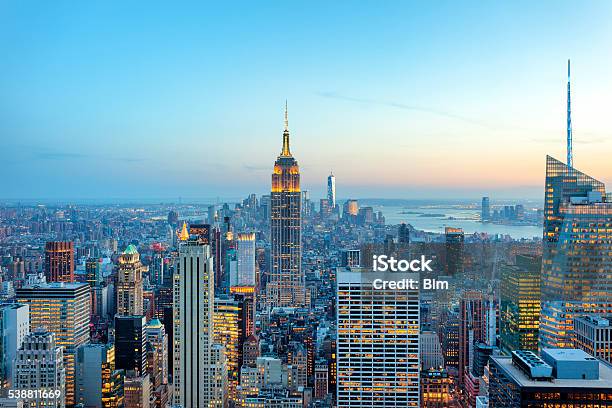 Manhattan Panorama With Its Skyscrapers Illuminated At Dusk New York Stock Photo - Download Image Now