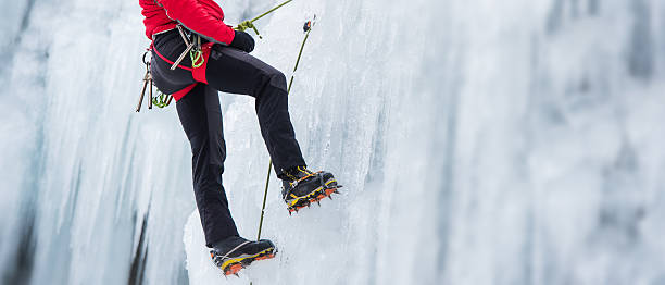 istock Ice Climber Ascending a Frozen Waterfall 538811737
