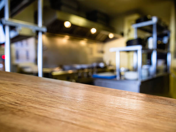istock Top of Wooden Table with Blurred Kitchen Restaurant Background 538811781