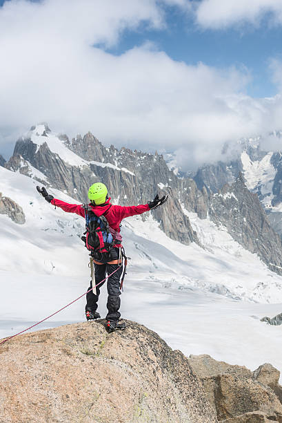 istock Mountaineer standing on  mountain with his arms spreed out 538812467